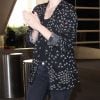 Exclusif - Milla Jovovich arrive à l'aéroport de LAX à Los Angeles, le 12 décembre 2017