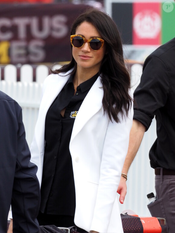 Le prince Harry, duc de Sussex, et Meghan Markle, duchesse de Sussex, enceinte, assistent au "Jaguar Land Rover Driving Challenge" en ouverture des "Invictus Games 2018" sur Cockatoo Island. Sydney, le 20 octobre 2018.