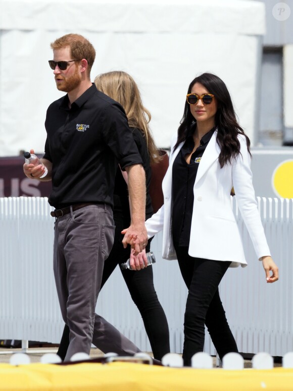 Le prince Harry, duc de Sussex, et Meghan Markle, duchesse de Sussex, enceinte, assistent au "Jaguar Land Rover Driving Challenge" en ouverture des "Invictus Games 2018" sur Cockatoo Island. Sydney, le 20 octobre 2018.