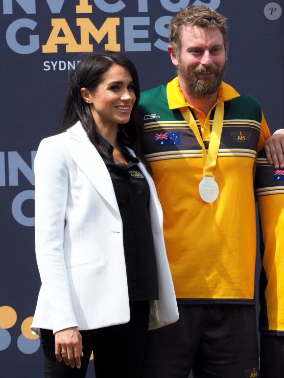 Le prince Harry, duc de Sussex, et Meghan Markle, duchesse de Sussex, enceinte, assistent au "Jaguar Land Rover Driving Challenge" en ouverture des "Invictus Games 2018" sur Cockatoo Island. Sydney, le 20 octobre 2018.