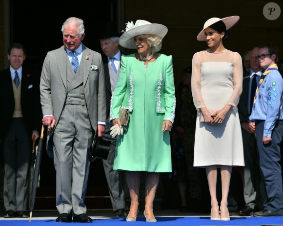 Le prince Charles, la duchesse Camilla et la duchesse Meghan (Meghan Markle) le 22 mai 2018 lors d'une des fameuses garden parties de Buckingham Palace, à Londres.