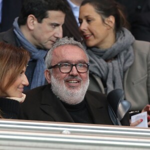 Dominique Farrugia et sa femme Isabelle - Huitième de finale retour entre le Paris Saint-Germain et le Bayer Leverkusen au Parc des Princes remporté par les parisiens sur le score de 2-1 à Paris le 12 mars 2014.