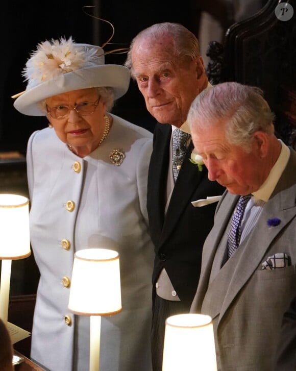 La reine Elizabeth II, le prince Philip, duc d'Edimbourg et le prince Charles au mariage de la princesse Eugenie d'York et Jack Brooksbank en la chapelle Saint-George au château de Windsor le 12 octobre 2018.