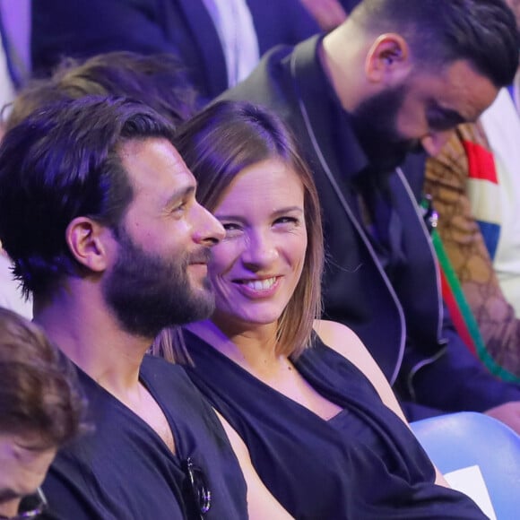 Maxim Nucci (Yodelice) et Isabelle Ithurburu, alors enceinte de leur fille Mia, en juin 2018 au Palais des Sports de Paris lors d'un match de boxe de Tony Yoka. © Veeren-CVS/Bestimage