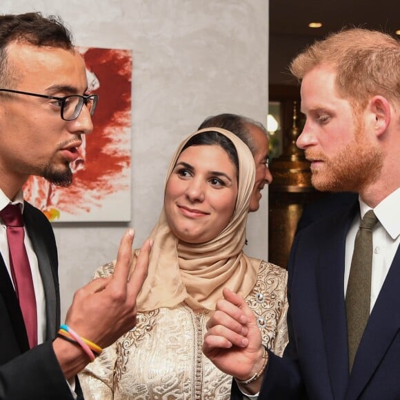 Le prince Harry, duc de Sussex, et Meghan Markle, duchesse de Sussex, enceinte assistent à une réception organisée par l'ambassadeur britannique au Maroc, à la résidence britannique de Rabat, le 24 février 2019.