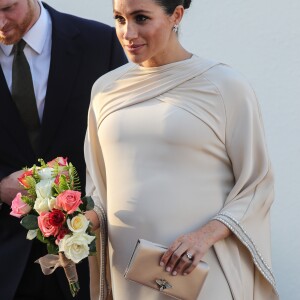 Le prince Harry, duc de Sussex, et Meghan Markle, duchesse de Sussex, enceinte assistent à une réception organisée par l'ambassadeur britannique au Maroc, à la résidence britannique de Rabat, le 24 février 2019.