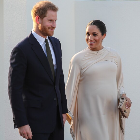 Le prince Harry, duc de Sussex, et Meghan Markle, duchesse de Sussex, enceinte assistent à une réception organisée par l'ambassadeur britannique au Maroc, à la résidence britannique de Rabat, le 24 février 2019.