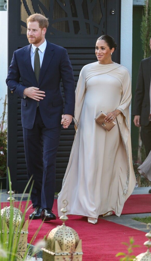 Le prince Harry, duc de Sussex, et Meghan Markle, duchesse de Sussex, enceinte assistent à une réception organisée par l'ambassadeur britannique au Maroc, à la résidence britannique de Rabat, le 24 février 2019.