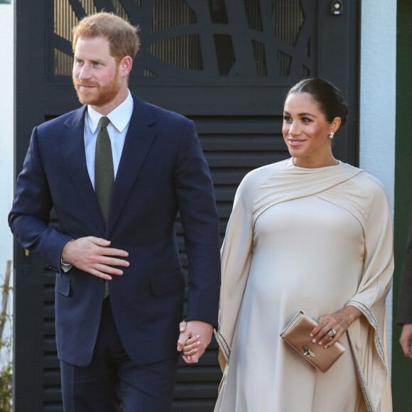 Le prince Harry, duc de Sussex, et Meghan Markle, duchesse de Sussex, enceinte assistent à une réception organisée par l'ambassadeur britannique au Maroc, à la résidence britannique de Rabat, le 24 février 2019.