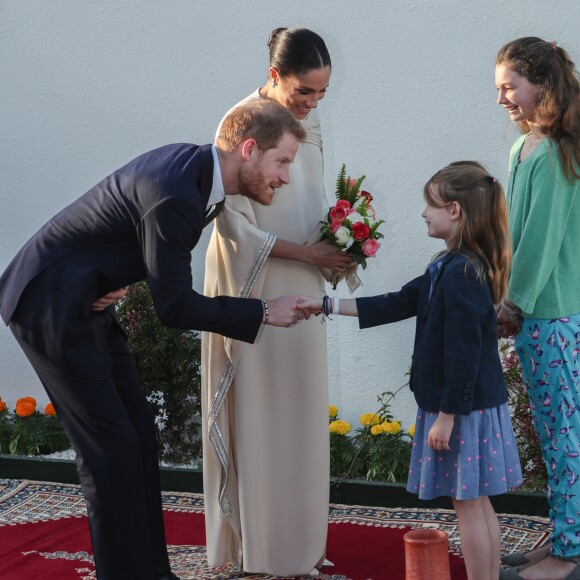 Le prince Harry, duc de Sussex, et Meghan Markle, duchesse de Sussex, enceinte assistent à une réception organisée par l'ambassadeur britannique au Maroc, à la résidence britannique de Rabat, le 24 février 2019.