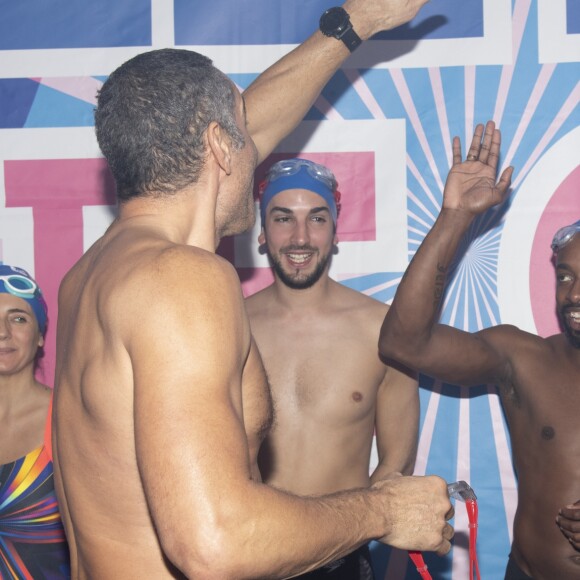 Estelle Denis, guest, Richard Dacoury et Sydney Govou lors du Challenges Swimming Heroes pour l'UNICEF lors du meeting Olympique à la piscine de Courbevoie, France, le 24 février 2019. © Pierre Perusseau/Bestimage