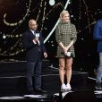 Lord Rumi Verjee, Pixie Lott et Kees Kruythoff lors de l'évènement WE Day au Wembley Arena à Londres, Royaume Uni, le 6 mars 2019.