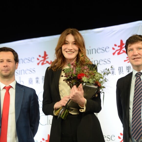 Exclusif - Carla Bruni Sarkozy (invitée d'honneur) et Harold Parisot (Président du Chinese Business Club) - Déjeuner "Chinese Business Club" au Pavillon Gabriel à Paris, à l'occasion de la journée mondiale des droits des femmes le 8 mars 2019. © Rachid Bellak/Bestimage