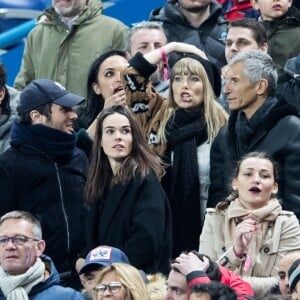 Emmanuel Levy dit Manu Levy, Vianney et sa compagne Catherine Robert, Valérie Bègue (Miss France 2008), Nagui et sa femme Mélanie Page - People assistent au match des éliminatoires de l'Euro 2020 entre la France et l'Islande au Stade de France à Saint-Denis le 25 mars 2019. La france a remporté le match sur le score de 4-0.