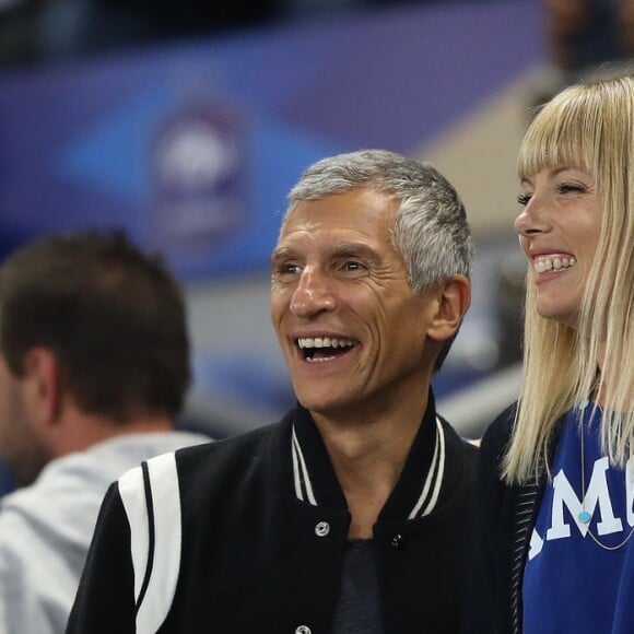 Nagui, sa femme Mélanie Page, Wilfried Mbappé et Claude Deschamps dans les tribunes du stade de France lors du match de ligue des nations opposant la France à l'Allemagne à Saint-Denis, Seine Saint-Denis, France, le 16 octobre 2018. La France a gagné 2-1.