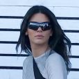 Exclusif - Kendall Jenner arrive sur le site de Coachella, elle porte un pantalon en cuir noir, un haut à manche longues gris et des lunettes de soleil, un look discret pour son arrivée. Indio, le 12 avril 2019.