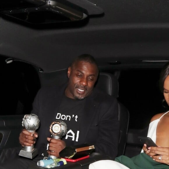 Idris Elba et Sabrina Dhowre à la sortie de la soirée des "National Film Awards 2019" à Londres, le 27 mars 2019.