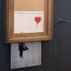 L'oeuvre autodétruite de Banksy "Love is in the bin" (Fille avec ballon) exposée au musée Frieder Burda à Baden-Baden en Allemagne, dont l'entrée est libre. Les visiteurs pourront faire une donation qui sera reversée aux réfugiés de Baden-Baden. Le 5 février 2019 05/02/2019 - Baden-Baden