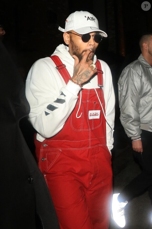 Chris Brown en salopette rouge - People au lancement de la collection boohoo.com au Dream Hollywood à Los Angeles le 21 mars 2018