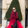 Céline Dion (qui porte une manteau en tulle rouge transparent) et son ami Pepe Munoz à la sortie de l'hotel Crillon à Paris se rendent au théâtre Mogador le 27 Janvier 2019