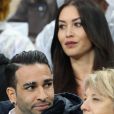 Adil Rami et Sidonie Biémont enceinte lors du match du quart de finale de l'UEFA Euro 2016 France-Islande au Stade de France à Saint-Denis, le 3 juillet 2016. © Cyril Moreau/Bestimage