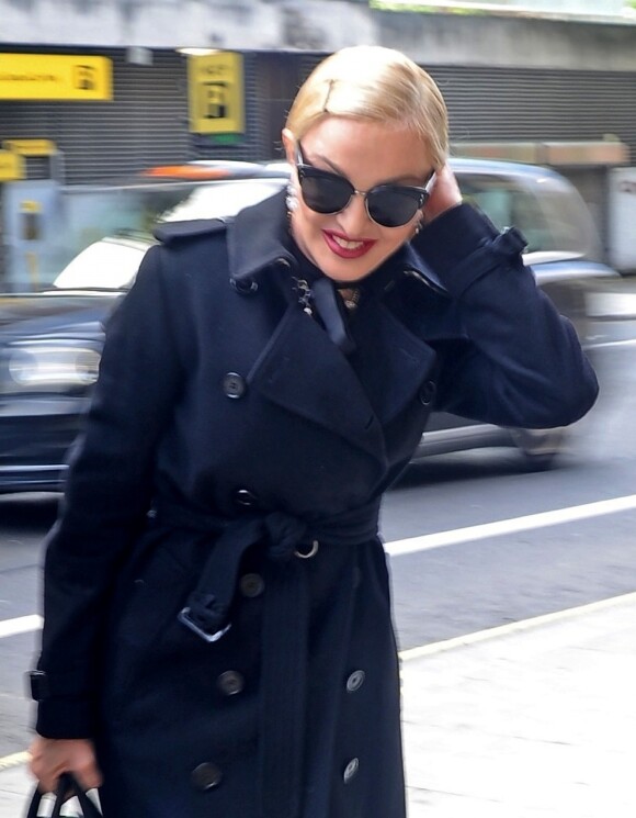 Exclusif - Madonna se promène dans les rues de Londres le 12 juin 2019.  Exclusive - For Germany call for price - London, UNITED KINGDOM - The Iconic American singer-songwriter Madonna seems well prepared for the inclement London weather by wearing a blue mac and dark sunglasses on june 12, 201912/06/2019 - London