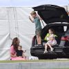 Kate Middleton, Louis, George et Charlotte pour le King Power Royal Charity Polo Day, le 10 juillet 2019.