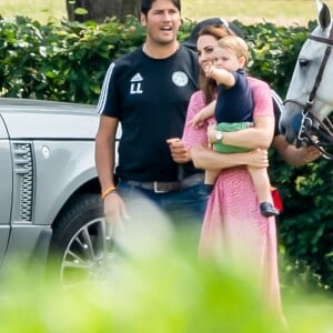 Catherine (Kate) Middleton, duchesse de Cambridge et le prince Louis de Cambridge lors d'un match de polo de bienfaisance King Power Royal Charity Polo Day à Wokinghan, comté de Berkshire, Royaume Uni, le 10 juillet 2019.