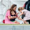 Catherine (Kate) Middleton, duchesse de Cambridge avec ses enfants, la princesse Charlotte de Cambridge et le prince Louis de Cambridge lors d'un match de polo de bienfaisance King Power Royal Charity Polo Day à Wokinghan, comté de Berkshire, Royaume Uni, le 10 juillet 2019.