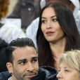Adil Rami et Sidonie Biémont enceinte lors du match du quart de finale de l'UEFA Euro 2016 France-Islande au Stade de France à Saint-Denis, le 3 juillet 2016. © Cyril Moreau/Bestimage