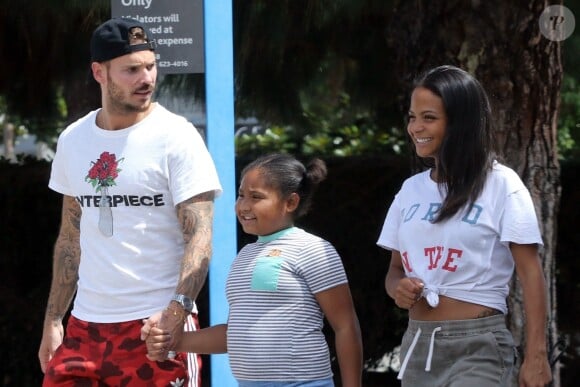 Matt Pokora, sa compagne Christina Milian enceinte et sa fille Violet Nash - Enceinte et radieuse, C.Milian se rend au glacier McConnell avec compagnon M.Pokora et sa fille V.Nash pour le goûter après avoir acheté des vêtements pour bébés. La chanteuse 'Dip it Low' et son compagnon ont annoncé sa grossesse la semaine dernière via Instagram. C'est le premier enfant du couple et le premier enfant de M.Pokora. Los Angeles, le 3 août 2019.