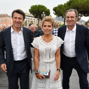 Christian Estrosi et sa femme Laura Tenoudji avec Renaud Muselier, président du conseil régional de la Région Sud, lors de "Lou Festin Nissart", le grand banquet populaire organisé dans le jardin Albert 1er à Nice par l'association des Amis du Maire, le 30 août 2019. © Bruno Bebert / Bestimage