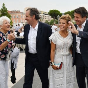 Christian Estrosi et sa femme Laura Tenoudji avec Renaud Muselier, président du conseil régional de la Région Sud, lors de "Lou Festin Nissart", le grand banquet populaire organisé dans le jardin Albert 1er à Nice par l'association des Amis du Maire, le 30 août 2019. © Bruno Bebert / Bestimage