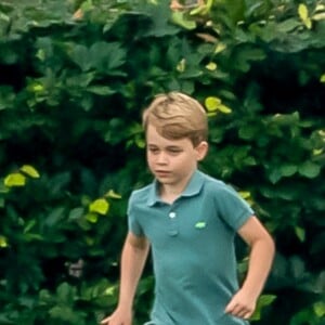 Le prince George de Cambridge jouant lors d'un match de polo disputé par le prince William à Wokinghan dans le Berkshire le 10 juillet 2019.