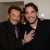 Johnny Hallyday et Sébastien Farran lors d'un événement chez Montaigne Market à Paris le 4 mars 2016.