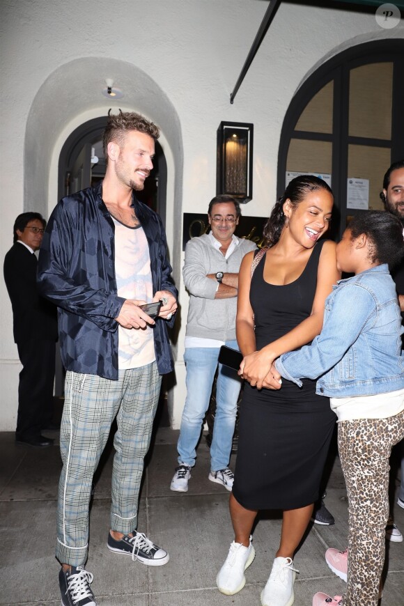 Christina Milian, enceinte, son compagnon Matt Pokora et sa fille Violet Madison sont allés dîner dans le restaurant Madeo à Beverly Hills, le 8 août 2019.