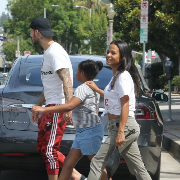 Matt Pokora, sa compagne Christina Milian enceinte et sa fille Violet Nash - Enceinte et radieuse, C.Milian se rend au glacier McConnell avec compagnon M.Pokora et sa fille V.Nash pour le goûter après avoir acheté des vêtements pour bébés. La chanteuse 'Dip it Low' et son compagnon ont annoncé sa grossesse la semaine dernière via Instagram. C'est le premier enfant du couple et le premier enfant de M.Pokora. Los Angeles, le 3 août 2019.