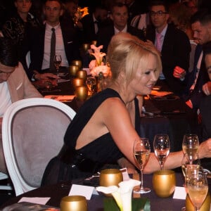 Adil Rami et Pamela Anderson lors de la soirée de la 28ème cérémonie des trophées UNFP (Union nationale des footballeurs professionnels) au Pavillon d'Armenonville à Paris, France, le 19 mai 2019.