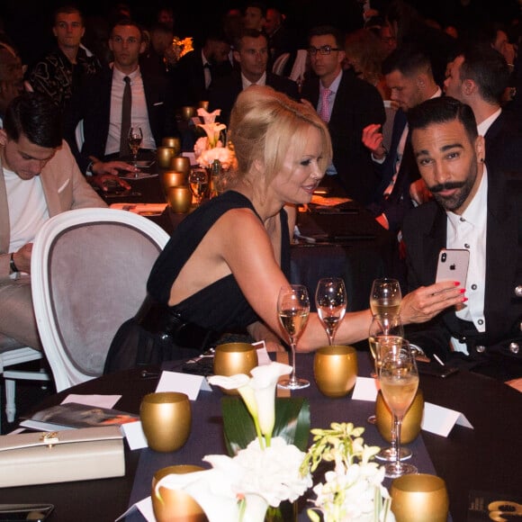 Adil Rami et Pamela Anderson lors de la soirée de la 28ème cérémonie des trophées UNFP (Union nationale des footballeurs professionnels) au Pavillon d'Armenonville à Paris, France, le 19 mai 2019.