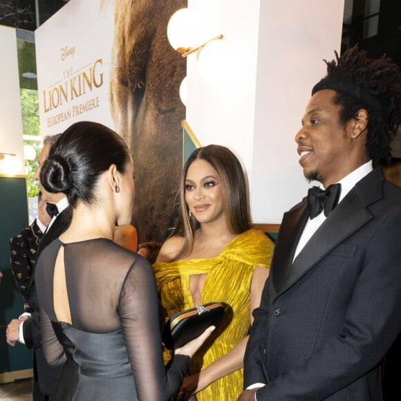 Le prince Harry, duc de Sussex, et Meghan Markle, duchesse de Sussex, avec Jay-Z et sa femme Beyonce Knowles à la première du film "Le Roi Lion" au cinéma Odeon Luxe Leicester Square à Londres, le 14 juillet 2019.