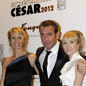 Alexandra Lamy, Jean Dujardin et Audrey Lamy en 2012 au Fouquet's. 