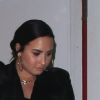 Demi Lovato se cache des photographes à la sortie du restaurant Craig à West Hollywood, le 5 mars 2019