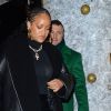 La chanteuse Rihanna, vêtue d'un manteau de cuir noir, quitte le club privé "Annabel" à Londres, avant de s'engouffrer dans un van noir, le 9 décembre 2019.