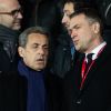 Nicolas Sarkozy et Oleg Petrov (vice président et directeur général de AS Monaco) dans les tribunes lors du match de Ligue 1 opposant le Paris Saint-Germain à l'AS Monaco au Parc des Princes à Paris, France, le 12 janvier 2020. Le PSG fait match nul face à l'AS Monaco (3-3).