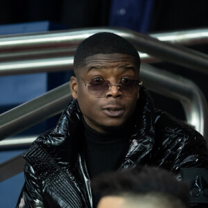 Le rappeur Ninho dans les tribunes lors du match de Ligue 1 opposant le Paris Saint-Germain à l'AS Monaco au Parc des Princes à Paris, France, le 12 janvier 2020. Le PSG fait match nul face à l'AS Monaco (3-3).  Celebs attending the French First League soccer match, between Paris Saint-Germain and AS Monaco at Parc des Princes stadium in Paris, France, on January 12, 2020. The match ended in a 3-3 draw.12/01/2020 - Paris