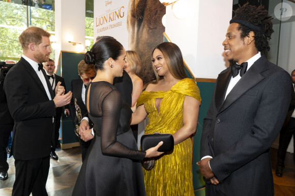 Le prince Harry, duc de Sussex, et Meghan Markle, duchesse de Sussex, avec Jay-Z et sa femme Beyonce Knowles à la première du film "Le Roi Lion" au cinéma Odeon Luxe Leicester Square à Londres, le 14 juillet 2019.