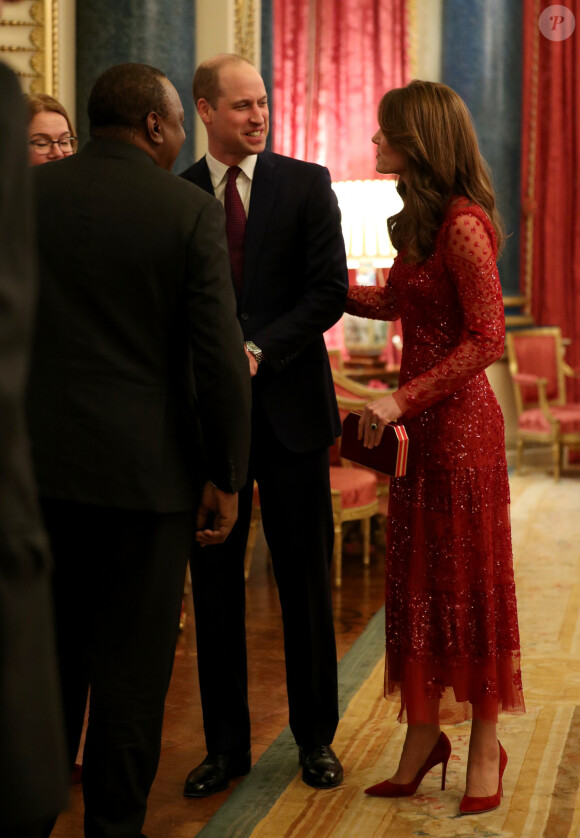 Le prince William, duc de Cambridge, et Kate Middleton, duchesse de Cambridge, accueillent les invités de la réception organisée pour le début du "Sommet Grande-Bretagne-Afrique sur les investissements" à Buckingham Palace, le 20 janvier 2020.