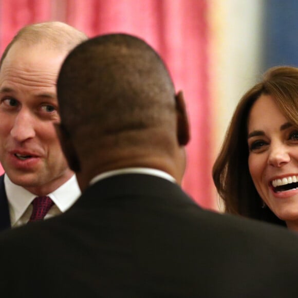 Le prince William, duc de Cambridge, et Kate Middleton, duchesse de Cambridge, accueillent les invités de la réception organisée pour le début du "Sommet Grande-Bretagne-Afrique sur les investissements" à Buckingham Palace, le 20 janvier 2020.