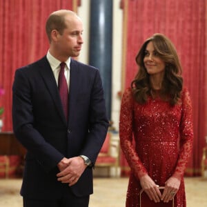 Le prince William, duc de Cambridge, et Kate Middleton, duchesse de Cambridge, accueillent les invités de la réception organisée pour le début du "Sommet Grande-Bretagne-Afrique sur les investissements" à Buckingham Palace, le 20 janvier 2020.