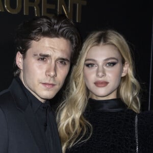 Brooklyn Beckham et Nicola Peltz assistent au défilé de mode Saint Laurent, collection prêt-à-porter automne-hiver 2020/2021, à la Tour Eiffel. Paris, le 25 février 2020. © Olivier Borde / Bestimage